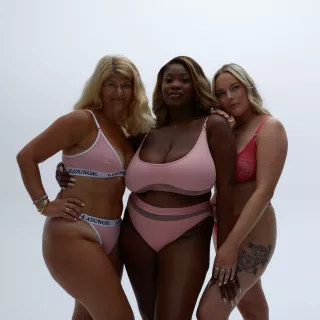 Photo from our corporate partner Lounge underwear from their breast cancer awareness campaign of 3 different female models wearing different pink underwear | CoppaFeel!