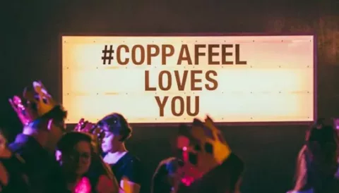 a light box sign that reads 'CoppaFeel! loves you'