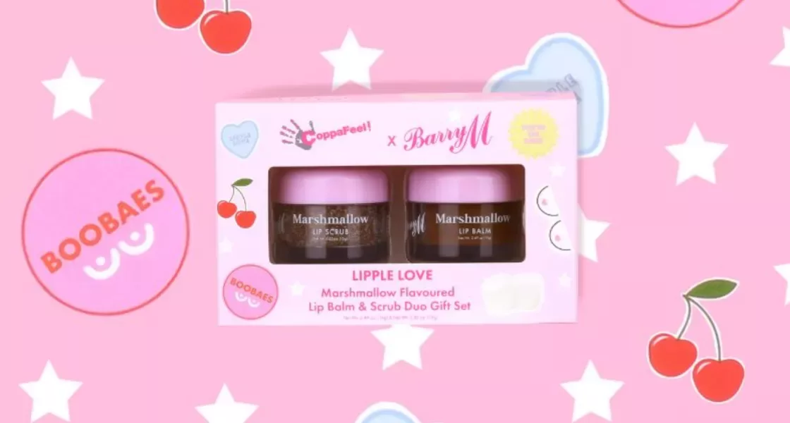 An image of a CoppaFeel! x Barry M lipple love, marshmallow flavoured lip balm and lip scrub gift set on a pink background with star and cherry sticker decals