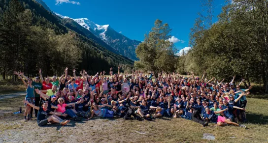 A group shot of everyone who took part in the CoppaTrek! with Gi 2023 in Mont Blanc. The group are all smiling in front of the French Alps
