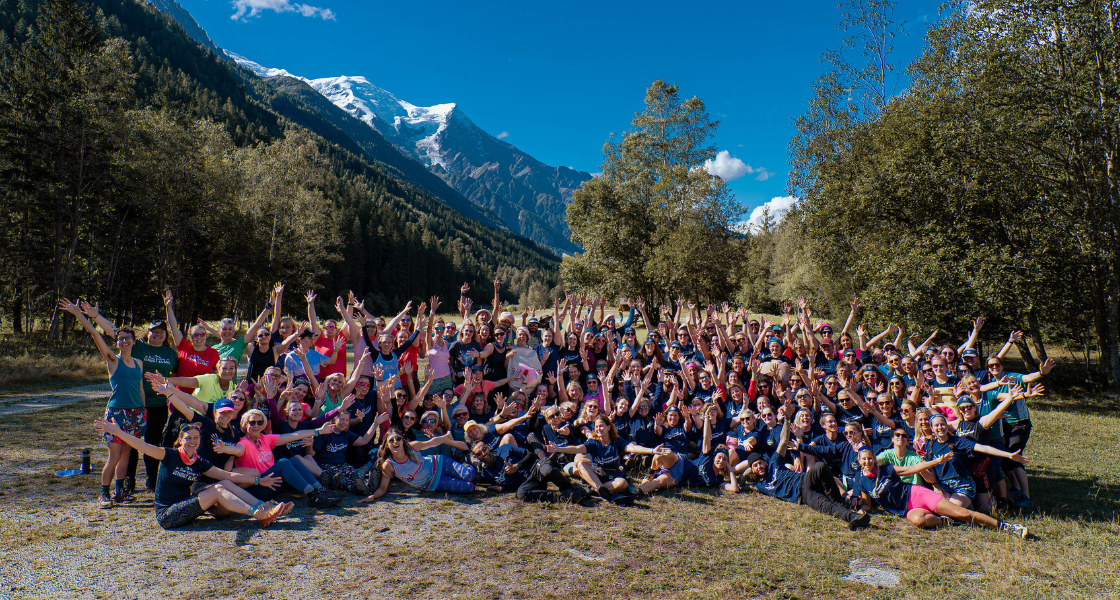 A group shot of everyone who took part in the CoppaTrek! with Gi 2023 in Mont Blanc. The group are all smiling in front of the French Alps