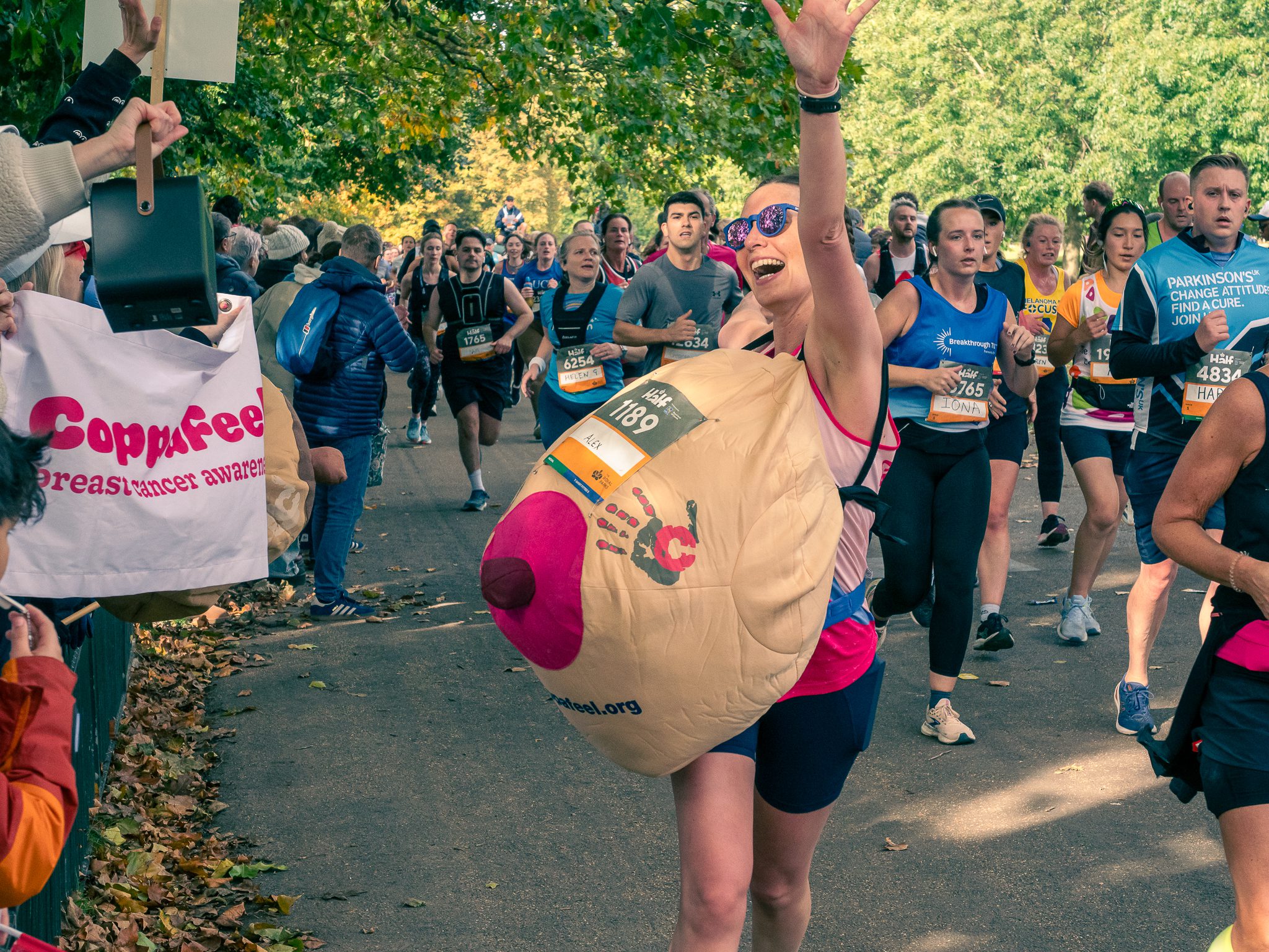 A woman poses in a boob suit